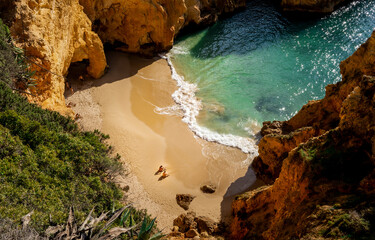 Sandy beach on mountain coast. Blue lagoon sandy beach