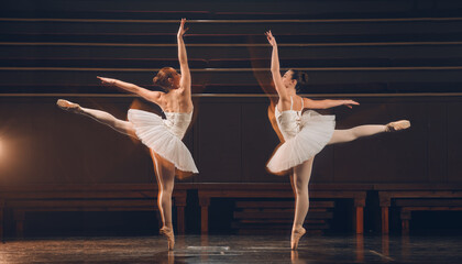 Women, ballet and stage for artistic dance, creative and practice performance in rehearsal. People, double exposure and balance in physical technique, students and team training on theatre platform © KayJoint/peopleimages.com