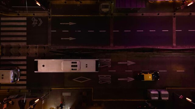 Buses and cars travel along Corrientes Avenue in Buenos Aires, Argentina. Locked down bird's eye view camera