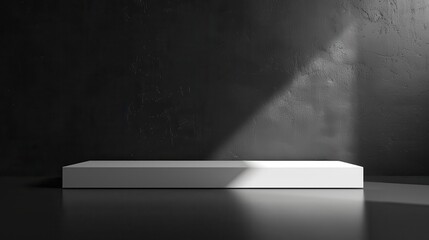 Obraz premium A white pedestal is in front of a black wall