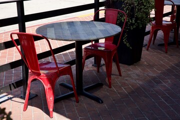 table and chairs at the sidewalk cafe