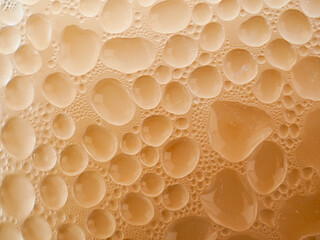 Drops of ice on an iced coffee glass

