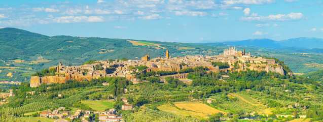 Orvieto, Italy. Afternoon view of Orvieto and its historic center. Countryside and hills surround the old Etruscan city in the province of Terni, Umbria. Banner header image. 2024-06-22.