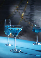 Glasses with blue alcohol cocktail ready for a party