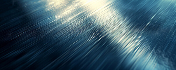Fototapeta premium A shiny, brushed metal background with a sleek, modern look and subtle patterns.