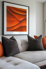 Modern interior | beige sofa | orange and black throw pillows | frame mockup with abstract art | white wall | minimalist decor | natural light | cozy living room | contemporary design