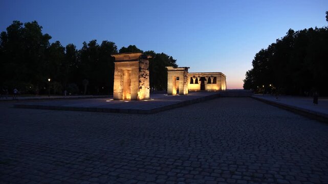 The Temple of Debod (Templo de Debod) in Madrid, Spain at Sunset. Night Time Lighting. Egyptian Monument in Europe. Wide View No Water in Pond.