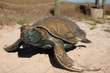 The sea turtle statue at the entrance of the fishing pier at Gulf State Park, Gulf Shores, Alabama