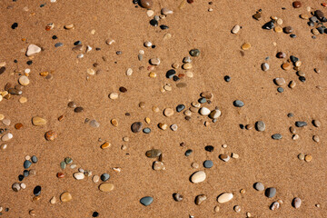 Numerous stones accumulating along the beach at Kohler-Andrae State Park, Sheboygan, Wisconsin