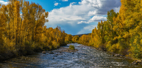 Autumn river flow. Autumn river landscape. autumn landscape with river