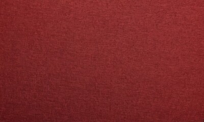 Fototapeta premium close-up of a red fabric with a textured surface.