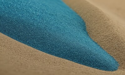 close-up of a surface with a blue and brown color gradient, with the blue area appearing to be a liquid or a substance.