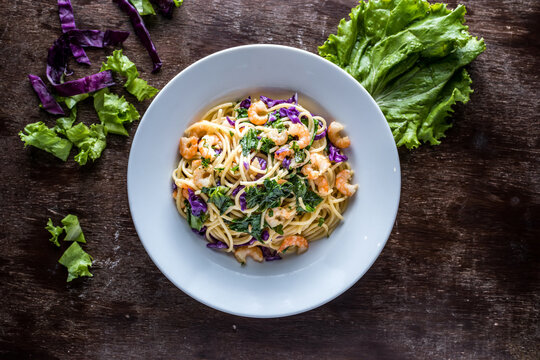 Spaghetti La Forchetta nooldes with shrimp and prawn served in plate isolated on table side view of italian food