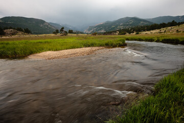 The Big Thompson River courses its way through Moraine Park as the morning rains fall on the...