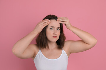 Fototapeta premium Woman with hair loss problem on pink background