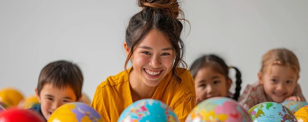 Happy teacher with diverse group of children exploring world globes in a classroom