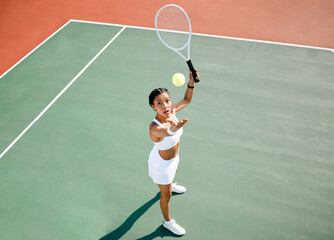 Serve, tennis player or woman in game for match, workout or sports exercise on outdoor court. Hobby, ball or above of girl athlete with skill or racket ready for playing, fitness training or practice