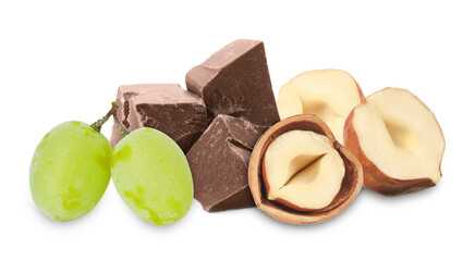 Hazelnuts, chocolate and green grapes isolated on white