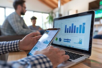 Digital Marketing: Dynamic team collaborating on innovative strategy using laptops and smartphones. Diverse professionals brainstorming ideas, analyzing data, and planning campaigns in modern office.