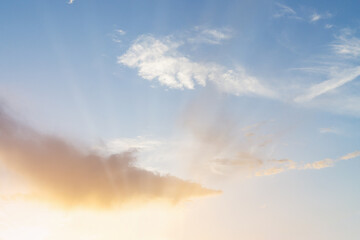 Sun rays and bright clouds sky. Copy space background.
