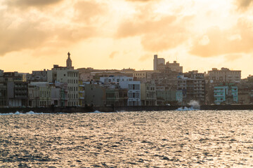 Malecon in Havana, Cuba and Old Havana at colorful sunset