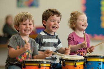 Three children are smiling while playing drums in a classroom setting.