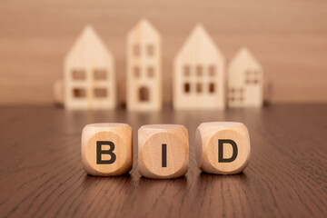 Real Estate question and answer idea illustrated with wooden blocks and model houses