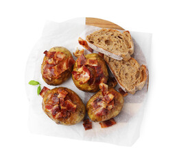 Delicious baked potatoes with bacon and bread isolated on white, top view