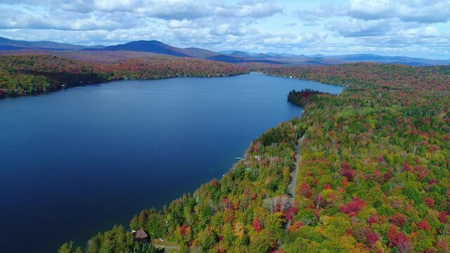Aerial Going Backwards Along Northern New England Lake in Autumn - Maidstone, Vermont