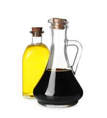 Balsamic vinegar in glass jug and oil isolated on white