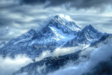 Obraz premium A mountain covered in snow and clouds, suitable for use as a background or landscape