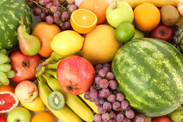 Many fresh ripe fruits as background, top view
