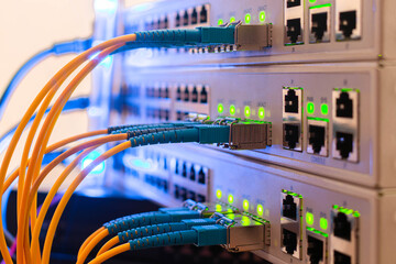 Fiber optic cables are connected to the switch interfaces. High speed concept