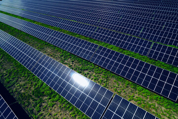 Solar panels or photovoltaic park generating green energy electric.Green energy reduce carbon emissions and makes earth cleaner and more ecological.	

