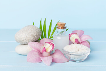 Composition with orchids, spa products on wooden table