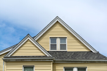 Yellow Family House with Cross Gable Roof in Brighton, Massachusetts, USA