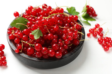 Fresh red currant berries on white table, closeup