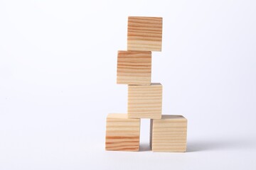 Many blank wooden cubes on white background, space for text