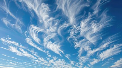 Wispy clouds creating patterns in a clear sky, intricate and delicate, cloud patterns