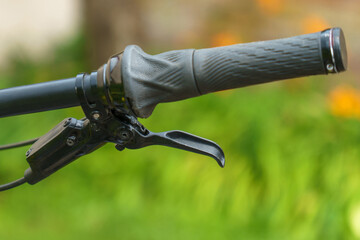 Modern mountain bike on the street. Details of a mountain bike in close-up.