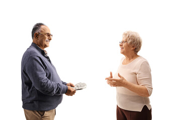 Mature man and woman talking and counting money