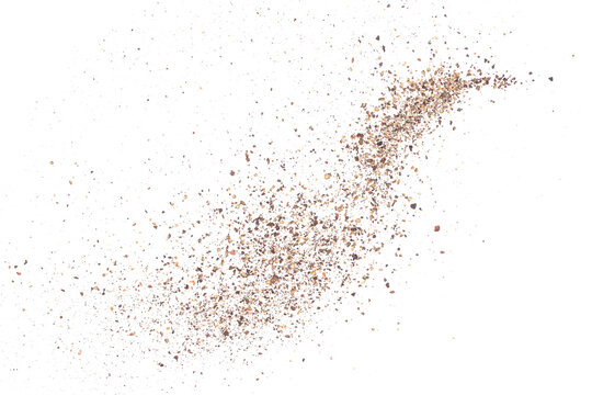 Minced black pepper, ground peppercorn pile flying isolated on white, macro