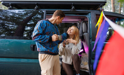 Charming Couple Resting with Tea at Camper