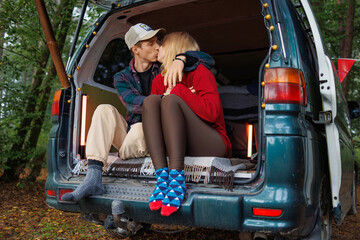 Intimate Moment in Forest Van: Young Couple Unwinds