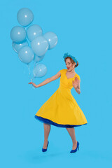 Woman in Yellow Dress Holding Blue Balloons Against Blue Background