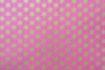 pink scrapbooking paper with embossed gold foil stars