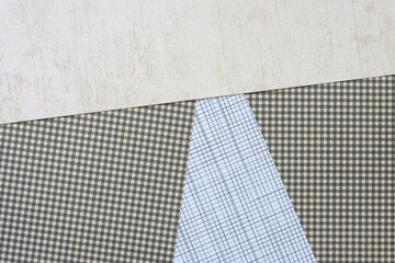 scrapbooking paper background featuring light beige, green plaid, and lines