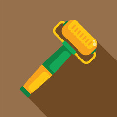 Yellow and green paint roller lying on a brown background with a shadow