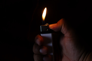 Man's hand with lighter