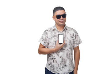 Man on vacation with sunglasses and smartphone. Interacting with cell phone. Device with blank space for mockup. Vacation concept.